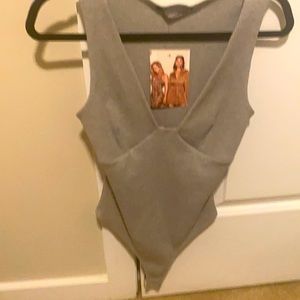 Naked wardrobe bodysuit size large never worn tag still on . Great quality